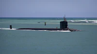 a black submarine in the ocean