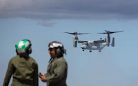 a military plane flying in the sky