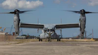 a military plane on a runway